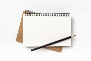 Business concept - Top view collection of two kraft spiral notebook and black pencil isolated on background for mockup