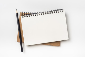 Business concept - Top view collection of two kraft spiral notebook and black pencil isolated on background for mockup
