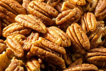 Pecans nuts. A close-up photograph. Unrefined whole kernel