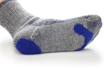 darning socks, repairing holes in socks on white background