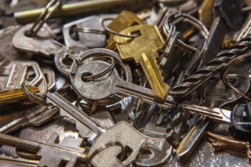 A Pile of old Keys different shapes and colors. Many vintage keys