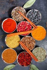 Spices and herbs. Variety of spices and mediterranean herbs on black stone