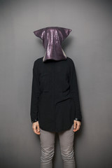 Woman with bag over her head