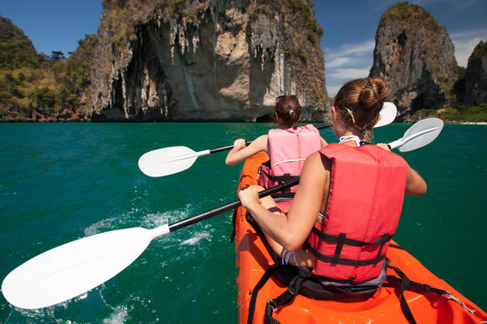 Women are kayaking in the open sea at the Krabi shore, Thailand
