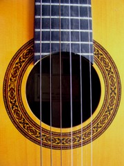 Obraz premium Close Up of an Acoustic Guitar With Ornate Decorative Sound Hole