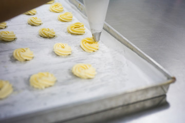 The chef is molding dough.