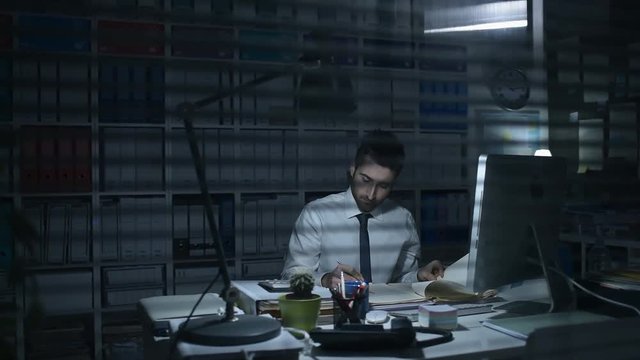 Businessman working in the office at night