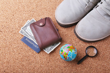 Set of men's accessories for the tourist on a white wooden background. The concept of fashion, leisure and travel.