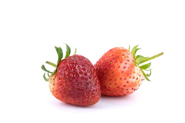 Close up two strawberries fruits Isolated on white background. Selective focus.
