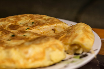 Spanish omelette in a plat with white background