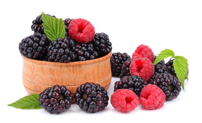 blackberries with raspberries in wooden bowl isolated on white background