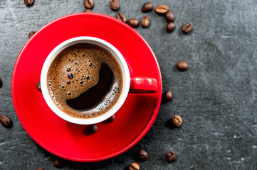 Coffee cup background with coffee beans top view.