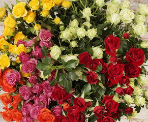 Flower bouquet background. Yellow and red roses.