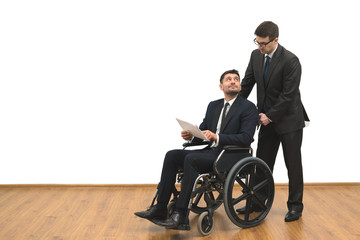 The businessman and invalid hold papers on the white wall background