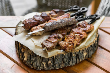 Barbecue meat. Grilled pork skewers on plate. selective focus
