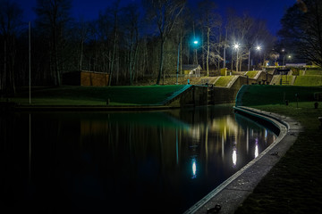 Fototapeta na wymiar illuminated canal locks a late evening