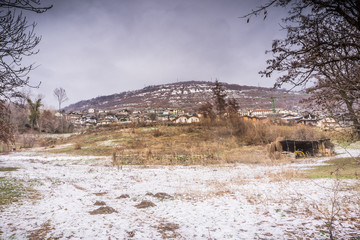 mountain landscape with snow, snowfall, day with bad weather and cloudy sky