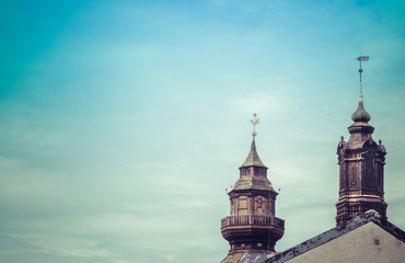 two church towers made of wood