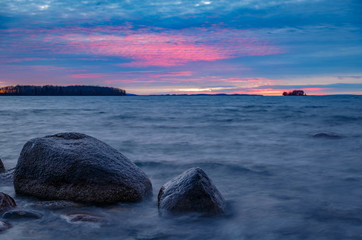 Fototapeta na wymiar sunset at a rocky beach