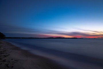 Fototapeta na wymiar Long exposure of sunset at a sandy beach