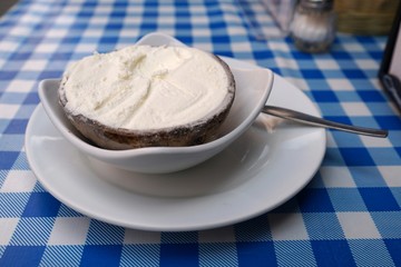 Coconut ice cream in coconut shell served with a spoon
