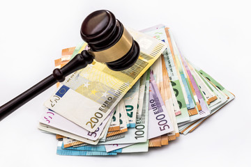 gavel on euro banknotes isolated on white