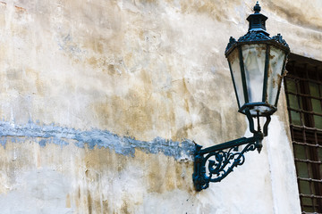 Vintage street lantern on the old wall on the streets of Prague, Czech Republic