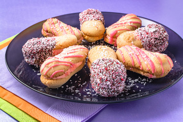 Almond and coconut cookies with chocolate and cream
