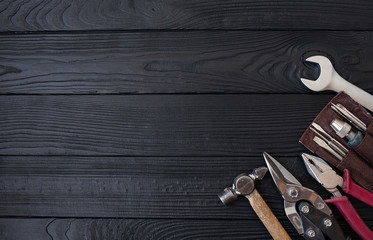 Close up tools on a wooden background