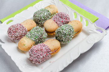 Almond and coconut cookies with chocolate and cream