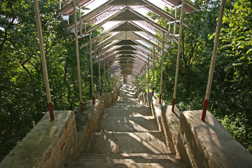 The extensive steps leading to the pagoda complex at the summit of the hill of the Su Taung Pyae Pagoda above Mandalay in Myanmar