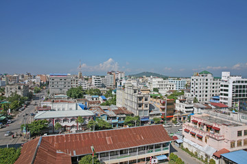 Fototapeta na wymiar The cityscape of downtown Mandalay on a sunny day in Myanmar
