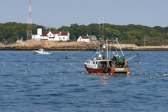 Fishing Trawler Coming Home By Eastern Point Lighthouse in Gloucester, Massachusetts