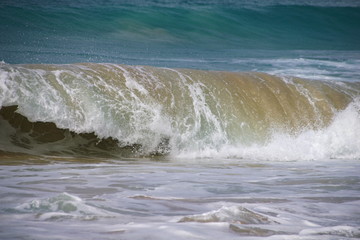 Waves breaking on tropical sand beach