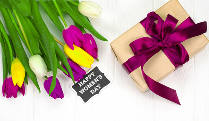tulips and gift on a white background
