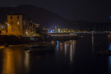 Komiza, town on Vis island Croatia, harbor by night. 