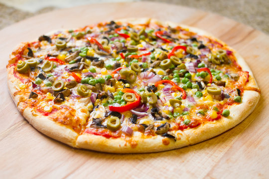 delicious vegetarian pizza on wood