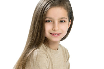 Caucasian girl child 7-8 years old, with long straight hair on white background, copy space