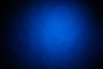 Blue light on black background