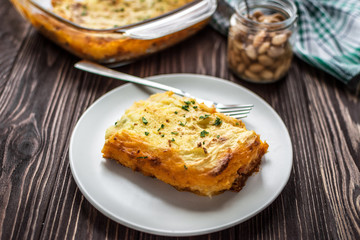 Shepherd's pie on a wooden background
