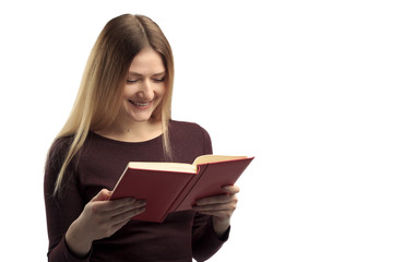 Fototapeta premium Young female happily reading book, isolated on white