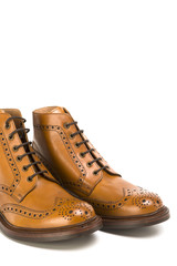Footwear Ideas. Closeup of Pair of  Premium Tanned Brogue Derby Boots Made of Calf Leather with Rubber Sole. Isolated Over Pure White Background.