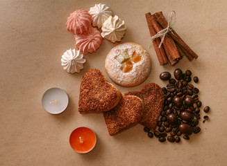 cookies meringue sticks cinnamon coffee beans and ioreshki in chocolate on a stone table top