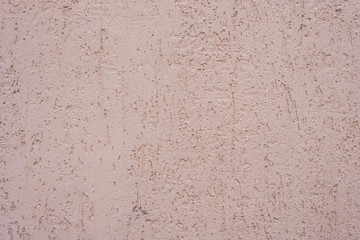 Rustic plastered wall of pastel tones - background, texture