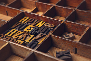 Random wooden typeset letters background, grunge and rustic