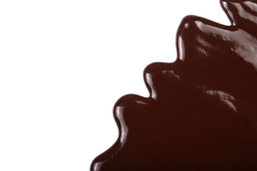 Melted chocolate dripping isolated on white background