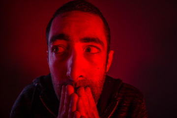 Stunned frightened man with surprised facial expression