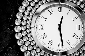 Classic dark and white round wall luxory clock, on black background