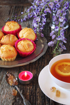 Spring tea: lemon muffins, tea and flowering wisteria