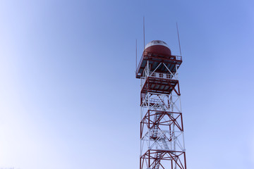 weather surveillance radar in a spherical protective dome, mounted on a trellis tower, against the...